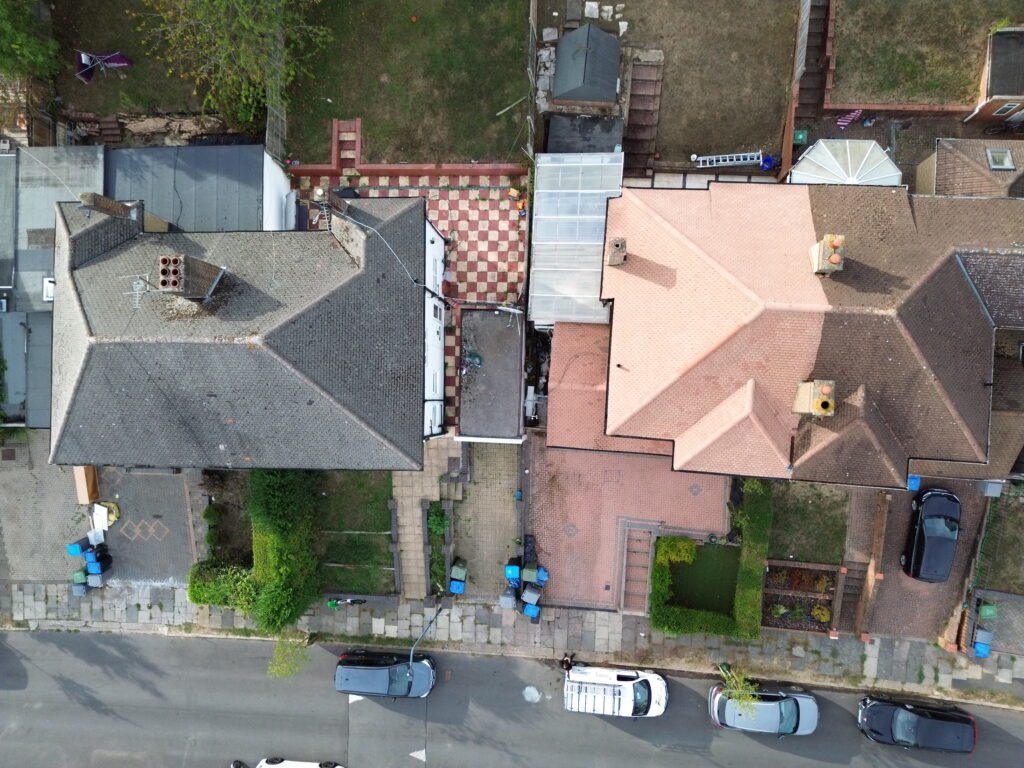 Aerial drone view of clean roof after professional roof cleaning in Wembley